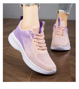 Close-up detail of lightweight pink and purple breathable fly-woven mesh sneakers