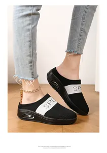 Close-up of comfortable black and white knit mules with thick platform air cushion sole