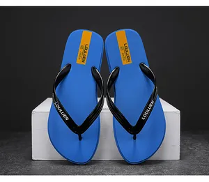 Blaue und schwarze rutschfeste Flip-Flops mit orangefarbenem Detail und LOULUEN-Logo