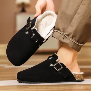 Black suede clogs with warm fleece lining and classic metal buckle detail