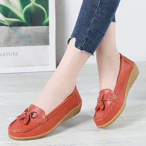 Elegant brick red leather loafers for women featuring tassels and soft flexible gum soles.