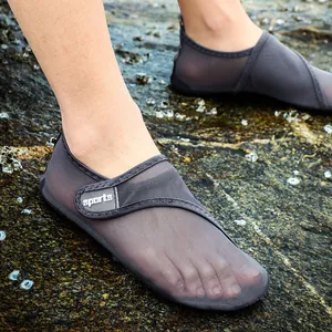 Close-up view of dark gray breathable mesh water shoes for outdoor beach activities.