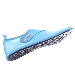 Close-up view of blue breathable mesh water shoes with velcro strap for beach activities