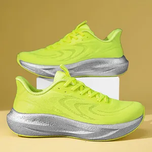 Detailed view of lime green fly-knit running shoes with thick silver cushioning soles