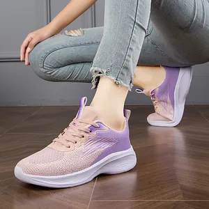 Women's lightweight breathable pink and purple fly-knit running sneakers with white soles