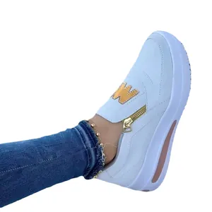 Comfortable women's white casual sneakers with gold zipper and metallic logo