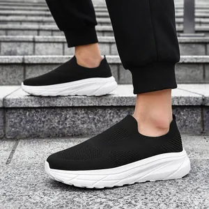 Detailed side view of breathable black fly-knit slip-on sports sneakers for men