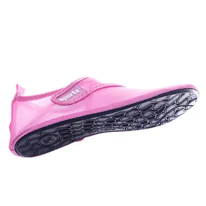 Close-up detail of a pink water shoe featuring breathable mesh and anti-slip rubber sole