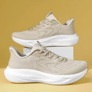 Close-up of beige breathable fly-knit running shoes with thick cushioned white soles