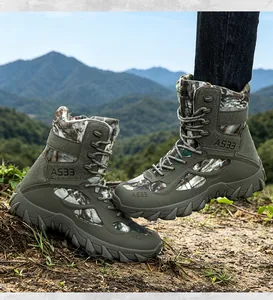 Close-up of camouflage tactical combat boots with durable non-slip soles for outdoor hiking