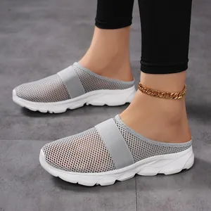 Women's breathable grey mesh slippers with thick white soles for daily casual wear.
