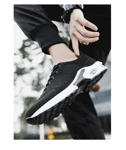 Detailed close-up view of black fly-woven athletic sneaker for men with air cushion sole
