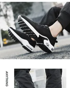 Detail view of black flyknit athletic shoes with white air cushion sole for men