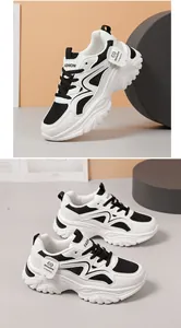 Gedetailleerd overzicht van chunky dames sneakers in zwart en wit met ademend mesh