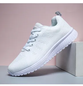 Side view of lightweight white breathable mesh running shoes with textured outsole