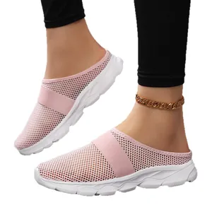 Stylish breathable pink mesh mule sneakers for women featuring a comfortable white sport sole
