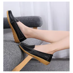 Detailed view of comfortable black leather loafers with soft gum soles on model