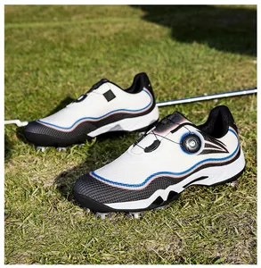Close-up of professional waterproof golf shoes with dial lacing system and spikes on grass