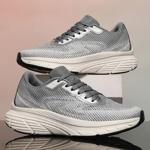 Detailed side view of grey flyknit running shoes with a wide-last design for men