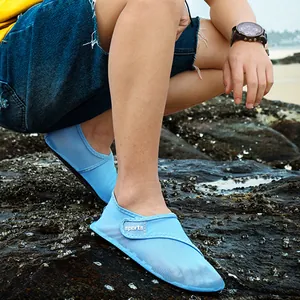 Detailed close-up of light blue mesh aqua shoes for beach and outdoor water sports