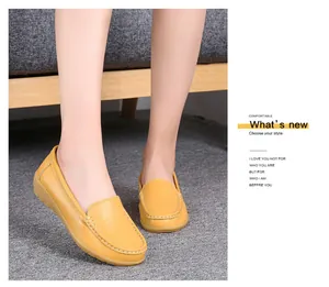 Comfortable yellow leather loafers for women with soft soles and moccasin stitching details