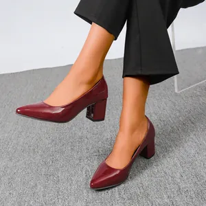 Elegant wine red patent leather block heel pumps featuring a glossy finish and pointed toe