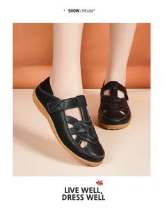 Detailed macro view of black hollow-out summer sandals for women with soft soles