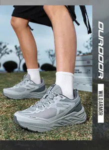 Detailed macro view of grey breathable outdoor sports sneakers with a chunky sole on grass