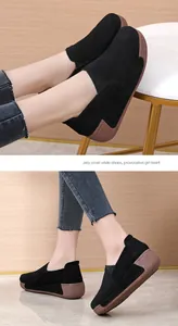 Women's black suede platform rocking shoes casual loafers shown on model indoors