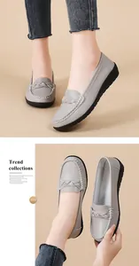 Detailed view of grey women's casual flat loafers with braided texture and soft sole.