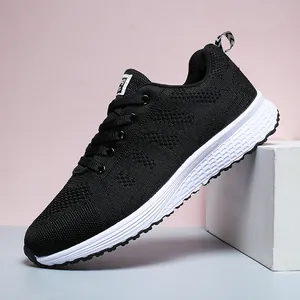 Lightweight breathable black fly-knit running sneaker with white sole and lace-up design