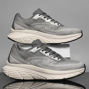 Side view of grey breathable mesh running shoes featuring thick cushioned beige soles