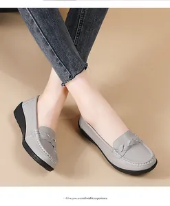 Women's comfortable grey leather loafers featuring braided detail and non-slip platform sole