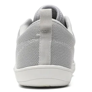 Rear view detail of grey breathable flying knit sneaker with white sole and pull tab