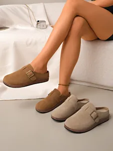 Variety of women's suede closed-toe mules with adjustable metal buckle shown in detail