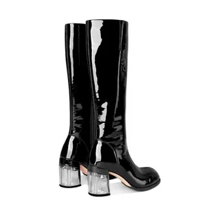 Elegant black patent leather knee-high boots featuring stylish clear block heels for women