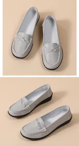 Detail view of grey casual flat loafers for women with soft rubber soles from multiple angles.