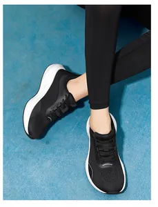Lightweight women's black fly-knit mesh running shoes featuring a comfortable wide toe box