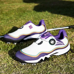 Waterproof white and purple golf shoes with rotary knob and spikes on grass