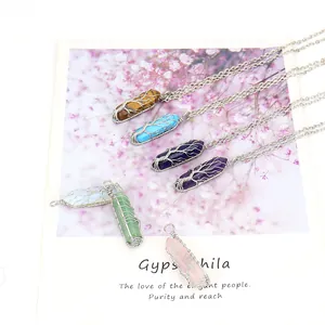 Detailed view of handmade tree of life wire-wrapped crystal hexagonal column necklaces
