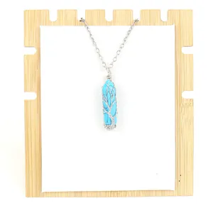 Detailed view of handmade wire-wrapped Tree of Life turquoise crystal necklace.