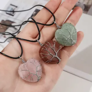 Three natural crystal heart pendants with wire-wrapped Tree of Life design on cords