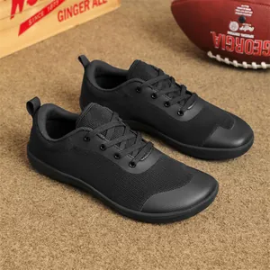 Side view of black breathable flyknit barefoot shoes with a wide toe box design.