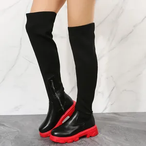 Black knitted over-the-knee boots with red thick platform soles and side zipper