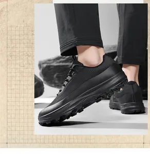 Men's all-black outdoor trail running shoes with breathable mesh and wide toe design.
