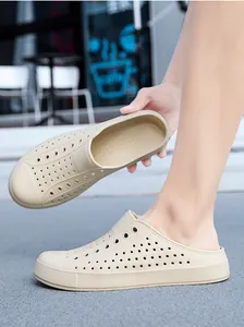 A detailed view showing the breathable holes and side profile of beige outdoor clogs.