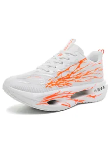 Side view of white kids running shoes with orange slash pattern and hollowed sole