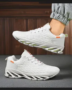 Close-up of white breathable fly-knit men's running shoes with blade sole detail