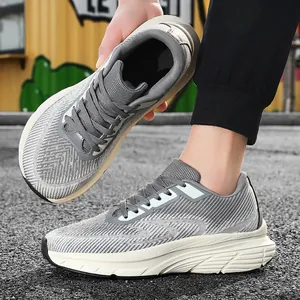 Detailed view of men's grey breathable flyknit running shoes with cushioned soles