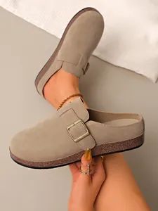 Detailed view of retro khaki suede closed-toe mule slippers with gold buckle accent